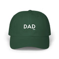 Green cap with 'DAD' printed on it against a white background